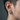 Side profile of men wearing the handcrafted oxidized silver hoop earring showcasing the detailed dragon skin texture