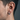 Side profile of man wearing the geometric hexagon hoop earring showcasing the 13mm diameter and secure hinged closure