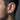 Side view of oxidized silver faceted hoop earring worn by a male model showcasing the chunky geometric design.