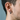 Close-up of minimal oxidized silver Greek key hoop earring worn by a male model showing size and scale
