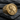 Capricorn Zodiac Ring in gold vermeil, angled view on dark stone