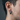 Close-up of men's chunky oxidized silver huggie hoop earring worn on the ear showing exact scale, texture and fit