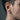 Side view of spiked hoop earring worn on a male model showing the brushed matte finish and secure hinged closure