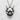 Close-up of handcrafted Japanese demon pendant highlighting deep dark oxidation and high relief silver details