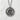 Close-up of the handcrafted Zen Enso pendant on textured white stone highlighting the gold calligraphy brushstroke