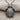 Close-up of the two-tone sea turtle pendant showing the intricate hexagonal shell pattern and oxidized silver backing edges