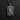 High-relief St. Jude pendant in sterling silver, detailing the saint's face and medallion on a dark slate background.