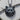 Close-up view of the handcrafted cat face pendant highlighting deep oxidation and lifelike feline details