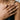 Feather Wrap Ring, worn on model's hand resting on shoulder