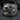 Close-up of handcrafted Great Wave ring on dark stone, highlighting deep oxidized silver contrast and Mount Fuji