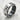 Close-up of the oxidized silver kanji spinner ring resting on a textured white stone showcasing the bold calligraphy