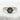 Angled view of handcrafted eternity kanji ring resting on textured white stone showcasing the polished silver band