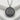 Tokyo Tower Medallion Pendant, oxidized, front view on stone slab