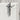 Handcrafted oxidized silver Jesus crucifix pendant hanging elegantly against a textured light stone background.