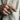Man wearing oxidized silver majestic lion ring on hand placing finger inside beige suit jacket pocket