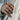 Close-up of handcrafted 925 sterling silver Celtic knot ring worn on a man's hand with linen suit jacket