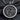 Back view of silver coin pendant showing stylized cloud patterns and central sun moon motif with oxidized finish
