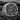 Gold vermeil variant of the Saint Michael ring showing detailed relief work and floral side engravings on dark slate