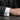 Close-up of men's formal suit sleeve showcasing the two-tone Masonic eagle design on oxidized silver cufflinks