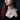 Woman wearing the handcrafted 925 sterling silver Lilith sigil pendant with blue opal stone on a delicate chain