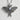 Close-up of handcrafted 925 silver luna moth pendant showcasing detailed wing textures on a concrete surface