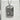 Close-up of the oxidized silver Empress Tarot pendant resting on a concrete block highlighting engraved details