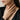 Woman wearing the 14K gold vermeil High Priestess tarot ring resting her hand elegantly against her neck