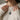 Lifestyle view of a woman wearing the oxidized silver Sagittarius zodiac pendant necklace over a cream sweater