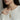 Model wearing delicate Chrysanthemum birth flower bar pendant necklace styled over a cozy white knitted sweater