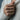 Close-up of woman wearing a dainty rose signet ring on her finger styled with a cozy white sweater