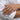 Worn view of dainty cat eye moonstone ring styled elegantly on finger against white shirt background