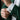 Close-up of classic green suit cuff showing Maya glyph cufflink in solid 925 sterling silver