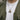 Front view of man wearing oxidized silver All-Seeing Eye pendant on a silver chain over a white t-shirt and grey hoodie