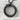Scaled Ouroboros Dragon Pendant, black rhodium, angled front view on stone pedestal