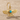 Farvahar Drop Earring in gold vermeil, angled view on sand