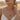 Model wearing dainty ouroboros serpent circle necklace in a desert sunset setting for lifestyle style view