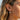 Model wearing 925 sterling silver lotus drop earring with two-tone gold vermeil flower detail