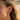 Side profile of woman wearing the oxidized silver hieroglyph ear cuff wrapped on ear cartilage for daily wear