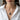 Woman wearing double snake pendant in 925 sterling silver with chain over white button shirt lifestyle view