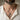 Man wearing handcrafted sterling silver Ouroboros dragon pendant necklace over a casual white linen shirt