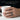 Lifestyle view of dark dragon band ring worn on male hand holding white ceramic mug for daily wear style