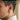 Male model wearing a rugged oxidized silver hammered hoop earring on earlobe for modern daily style