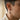 Side view of man wearing oxidized silver shard dangle earring showing fit and scale on earlobe