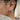 Men's crater huggie earring worn on ear lobe showing oxidized silver texture and comfortable huggie fit