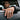 Lifestyle view of a man wearing a handcrafted oxidized silver melted signet ring on his index finger