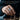 Man wearing the oxidized silver Great Wave archer thumb ring on hand while moving chess piece