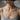 Model wearing gold version of Victorian rose pendant necklace showing chain placement and everyday wear style