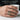 Man wearing gold vermeil St Michael ring holding a ceramic cup showcasing daily wear and ring proportions