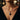 Woman wearing the oxidized silver Memento Mori skull necklace featuring a two-tone gold Masonic emblem detail