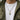 Front view of man wearing oxidized silver Masonic dog tag pendant with an olive green jacket over a white t-shirt